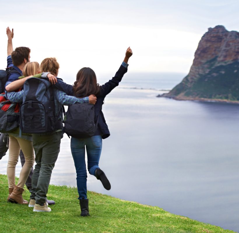 Holiday fun and excitement. A group of young people admiring the view together